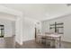 Dining area with farmhouse table and chairs, and kitchen access at 15425 White Linen Dr, Bradenton, FL 34211