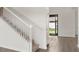 Modern white staircase leading to the second floor at 15425 White Linen Dr, Bradenton, FL 34211
