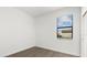 Simple bedroom with wood-look floors and large window at 15425 White Linen Dr, Bradenton, FL 34211