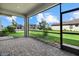 Screened-in patio with paver floor and backyard view at 15425 White Linen Dr, Bradenton, FL 34211