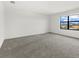 Bright bedroom with a large window and grey carpet at 15425 White Linen Dr, Bradenton, FL 34211