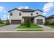Two-story house with gray siding and gray garage doors at 15425 White Linen Dr, Bradenton, FL 34211
