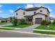 Two-story house with gray siding, gray paved driveway, and landscaping at 15425 White Linen Dr, Bradenton, FL 34211