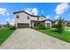 Two-story house with gray siding, gray paved driveway, and landscaping at 15425 White Linen Dr, Bradenton, FL 34211