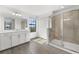 Bright bathroom boasts a walk-in shower and modern vanity at 15425 White Linen Dr, Bradenton, FL 34211