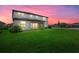 Spacious backyard with lush lawn and sunset view at 15425 White Linen Dr, Bradenton, FL 34211