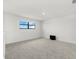 Spacious loft bedroom with a window and grey carpet at 15425 White Linen Dr, Bradenton, FL 34211