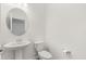 Clean and modern bathroom with pedestal sink and toilet at 15425 White Linen Dr, Bradenton, FL 34211