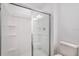 Bathroom features a glass-enclosed shower with built-in shelving at 3067 Novara Ln, Lakewood Ranch, FL 34211