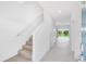 Bright entryway with staircase and view into the living area at 3145 Novara Ln, Lakewood Ranch, FL 34211