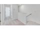 Upstairs hallway with carpeted flooring and access to bedrooms at 3145 Novara Ln, Lakewood Ranch, FL 34211