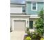 Two-story townhome with attached garage and landscaped front yard at 3063 Novara Ln, Lakewood Ranch, FL 34211