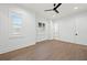 Bright bedroom with hardwood floors, plantation shutters, and neutral paint, creating a serene atmosphere at 1783 Bayview Dr, Sarasota, FL 34239