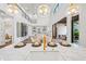 Open floor plan with large windows, an island with marble counters and pendant lighting at 1783 Bayview Dr, Sarasota, FL 34239