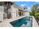 Backyard pool features outdoor spiral staircase and partial view of covered patio at 1783 Bayview Dr, Sarasota, FL 34239