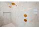 This walk-in shower has dual shower heads, bench seating, decorative gold fixtures, and marble walls at 1783 Bayview Dr, Sarasota, FL 34239