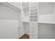 Well-organized walk-in closet with ample shelving, drawers, and hanging space for optimal storage at 1783 Bayview Dr, Sarasota, FL 34239