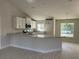 Modern kitchen featuring an island and ample counter space at 6732 Beckwith Ave, North Port, FL 34291