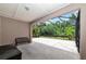 Covered patio with screened enclosure and bench at 5919 Lexington Dr, Parrish, FL 34219