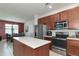 Modern kitchen with stainless steel appliances and an island at 5919 Lexington Dr, Parrish, FL 34219