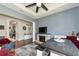 Bright living room with hardwood floors, fireplace, kitchen view, and ample natural light at 5919 Lexington Dr, Parrish, FL 34219