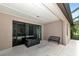 Covered patio with screened enclosure and bench at 5919 Lexington Dr, Parrish, FL 34219