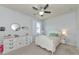 Bright bedroom with white furniture and a ceiling fan at 5919 Lexington Dr, Parrish, FL 34219