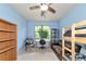 Bright bedroom with bunk beds, a desk, and a window at 5919 Lexington Dr, Parrish, FL 34219