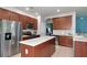 Modern kitchen with stainless steel appliances and an island at 5919 Lexington Dr, Parrish, FL 34219
