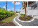 Modern walkway with gray pavers and white accents winds through the backyard at 1783 Bayview Dr, Sarasota, FL 34239