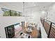 High-ceiling living room, open concept with kitchen and formal dining areas at 1783 Bayview Dr, Sarasota, FL 34239