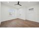Bright bedroom with hardwood floors and window shutters at 1783 Bayview Dr, Sarasota, FL 34239