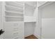 Well-organized walk-in closet with shelves and hanging space at 1783 Bayview Dr, Sarasota, FL 34239
