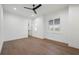 Bright bedroom with hardwood floors, plantation shutters, and ceiling fan at 1783 Bayview Dr, Sarasota, FL 34239