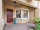 Front door entrance with brick walkway and potted plant at 13822 Messina Loop # 101, Bradenton, FL 34211