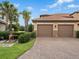 Two-car garage with brick paver driveway at 13822 Messina Loop # 101, Bradenton, FL 34211