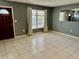 Bright living room with tile floors and large window at 3553 Syracuse St, Port Charlotte, FL 33952
