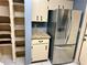 Kitchen features stainless steel appliances and tiled countertops at 3553 Syracuse St, Port Charlotte, FL 33952