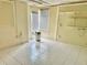Bright laundry room with window and tiled floors at 3553 Syracuse St, Port Charlotte, FL 33952