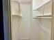 White closet with shelving and hanging rods. Offers ample storage space at 3553 Syracuse St, Port Charlotte, FL 33952