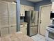 Kitchen features stainless steel appliances and pantry at 3553 Syracuse St, Port Charlotte, FL 33952