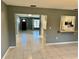 Open concept living area with views of kitchen and entryway at 3553 Syracuse St, Port Charlotte, FL 33952