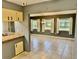 Dining area with tile floor and view to backyard at 3553 Syracuse St, Port Charlotte, FL 33952
