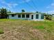 View of the back of the house and large yard at 3553 Syracuse St, Port Charlotte, FL 33952