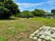 Large grassy backyard with screened pool at 3553 Syracuse St, Port Charlotte, FL 33952