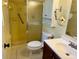 Bathroom with yellow tiled shower, toilet, and vanity at 3553 Syracuse St, Port Charlotte, FL 33952