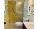 Bathroom with yellow tiled shower, toilet, and vanity at 3553 Syracuse St, Port Charlotte, FL 33952