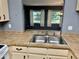 Kitchen with a double sink and view of dining area at 3553 Syracuse St, Port Charlotte, FL 33952