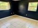 Bedroom with two windows and tiled floors at 3553 Syracuse St, Port Charlotte, FL 33952