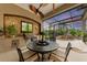 An outdoor kitchen and dining area, overlooking a refreshing pool and spa at 4713 Mainsail Dr, Bradenton, FL 34208